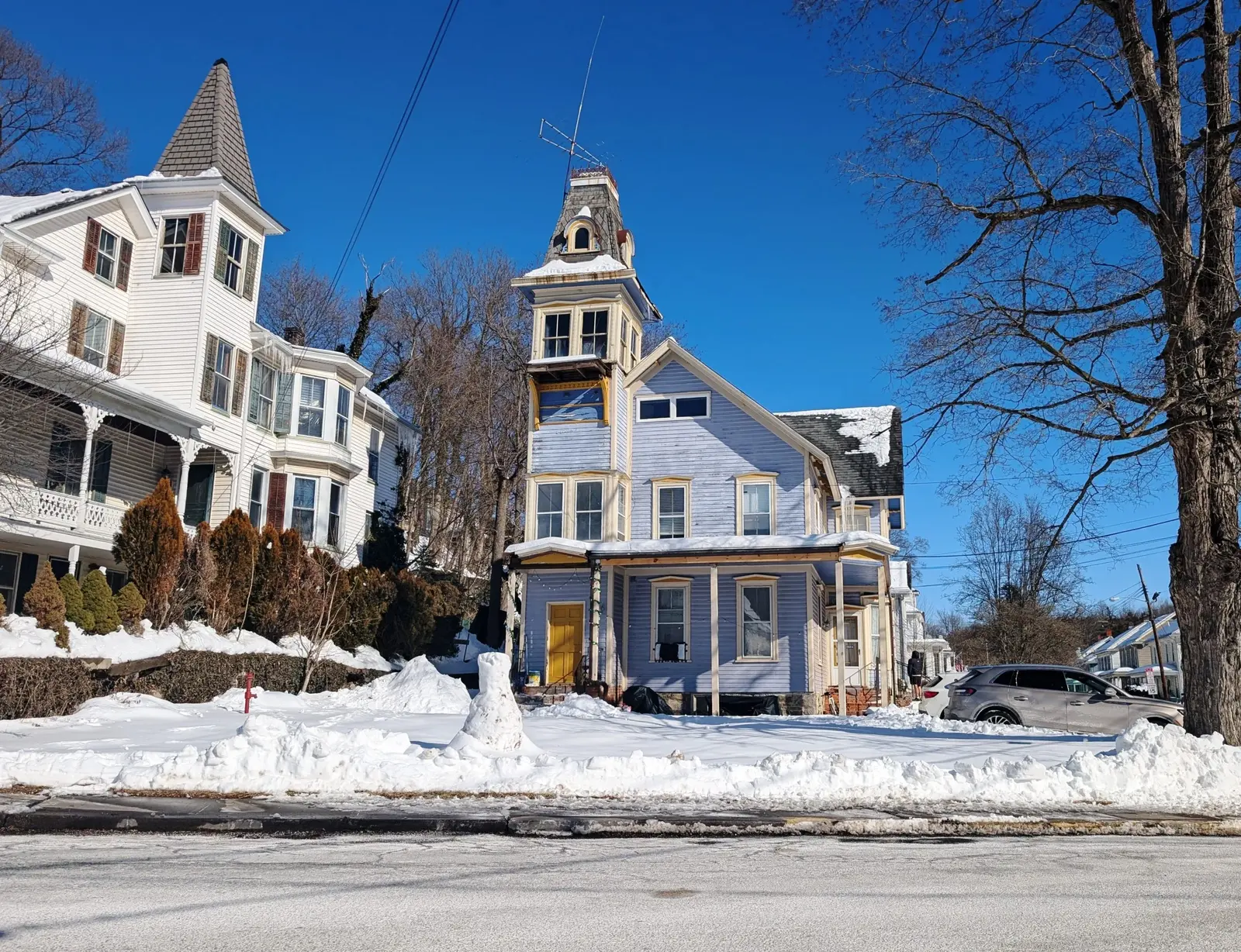 Snow-covered houses at the junction of Bridge Street and Main Street in Blairstown, New Jersey.
