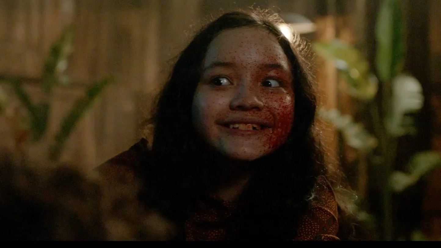 Young actress Makayla Rose Hilli as Kumala being possessed by Sumala