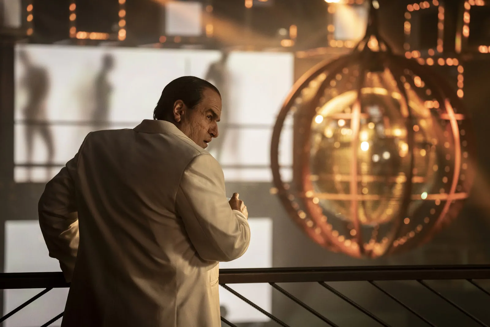 Colin Farrell as Oz Cobb standing in a rain-soaked Gotham street in The Penguin Season 1